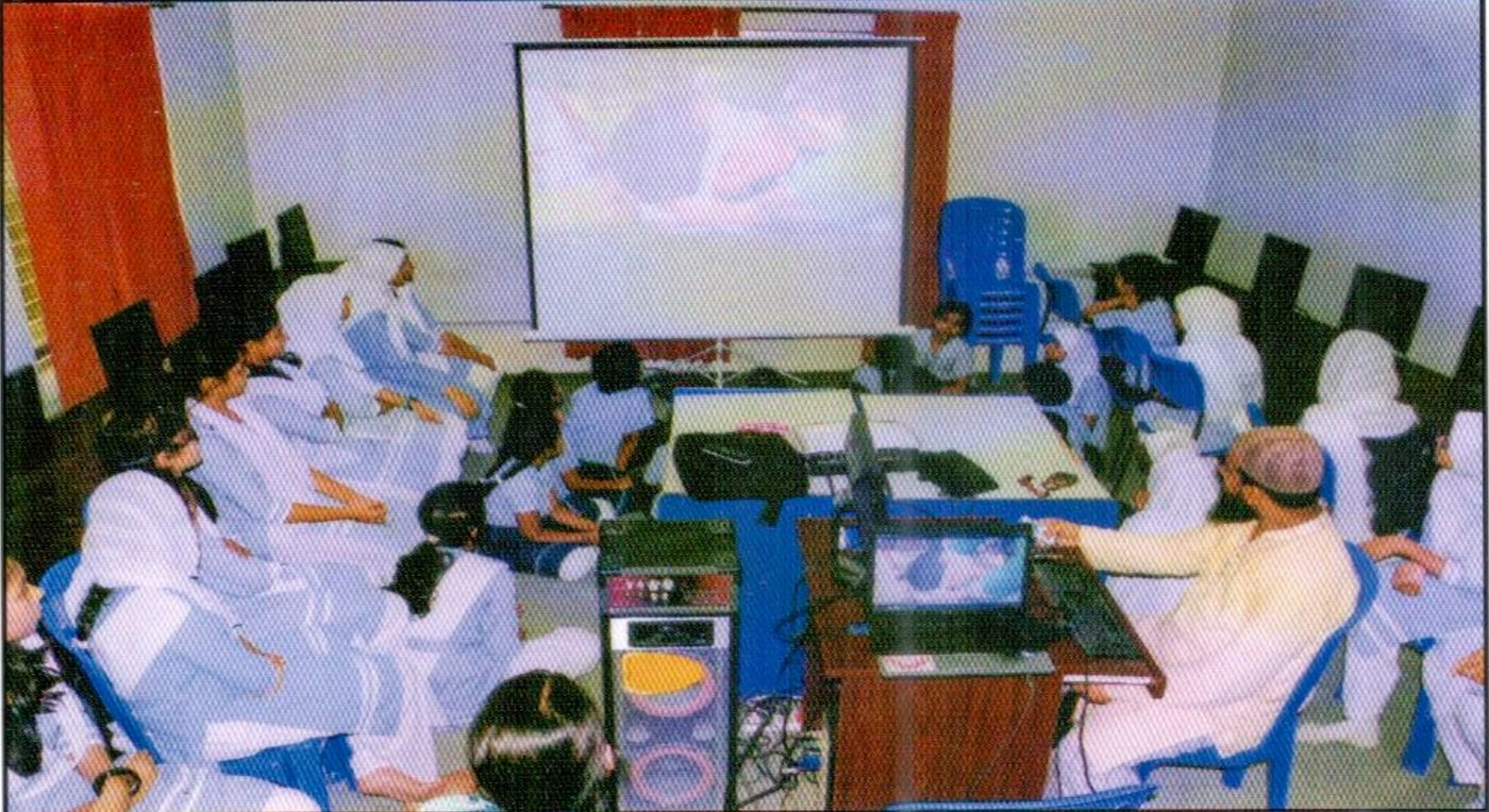 Students and teachers using technology in the classroom